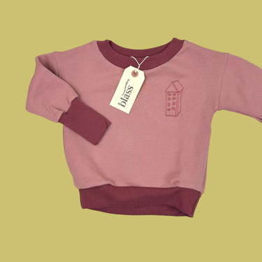 Pull évolutif rose (tailles variées)